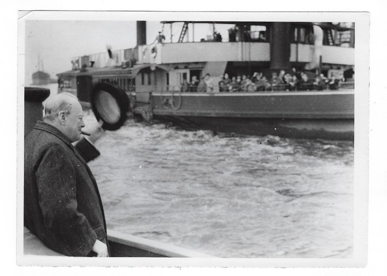 Item #004848 A wartime press photograph from The Associated Press German Picture Service of Prime Minister Winston S. Churchill, the German caption stating that Churchill is depicted on his way to examine the Luftwaffe damage at the London docks on 11 October 1940