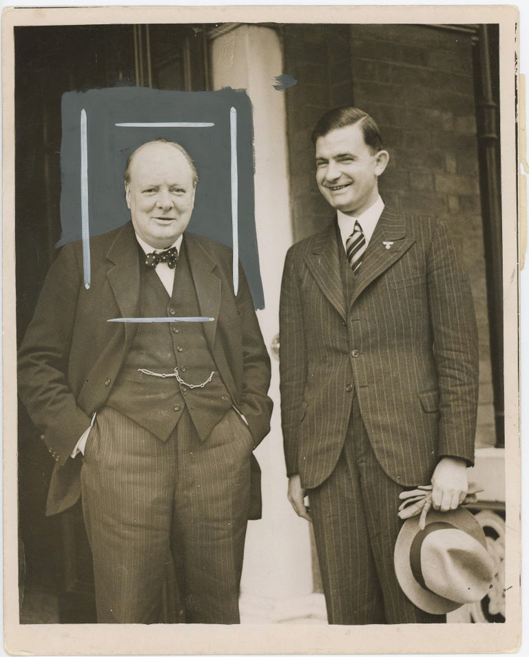Item #005201 An original press photograph of the improbable spectacle of Winston S. Churchill with Ernst Bohle, the leader of the Organization of the Nazi Party Abroad, smiling together at the end of their 1 October 1937 meeting at Churchill's London residence