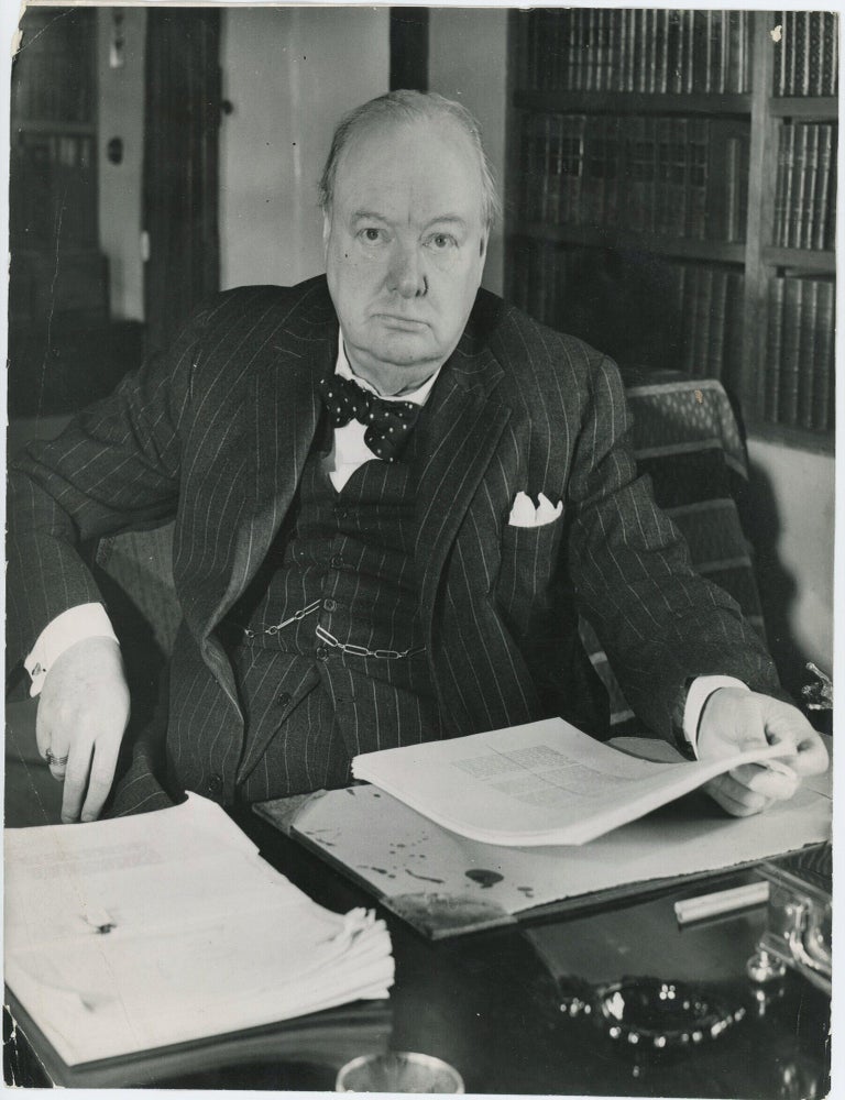 An original press photograph capturing Winston S. Churchill in late April 1948 reviewing galleys...