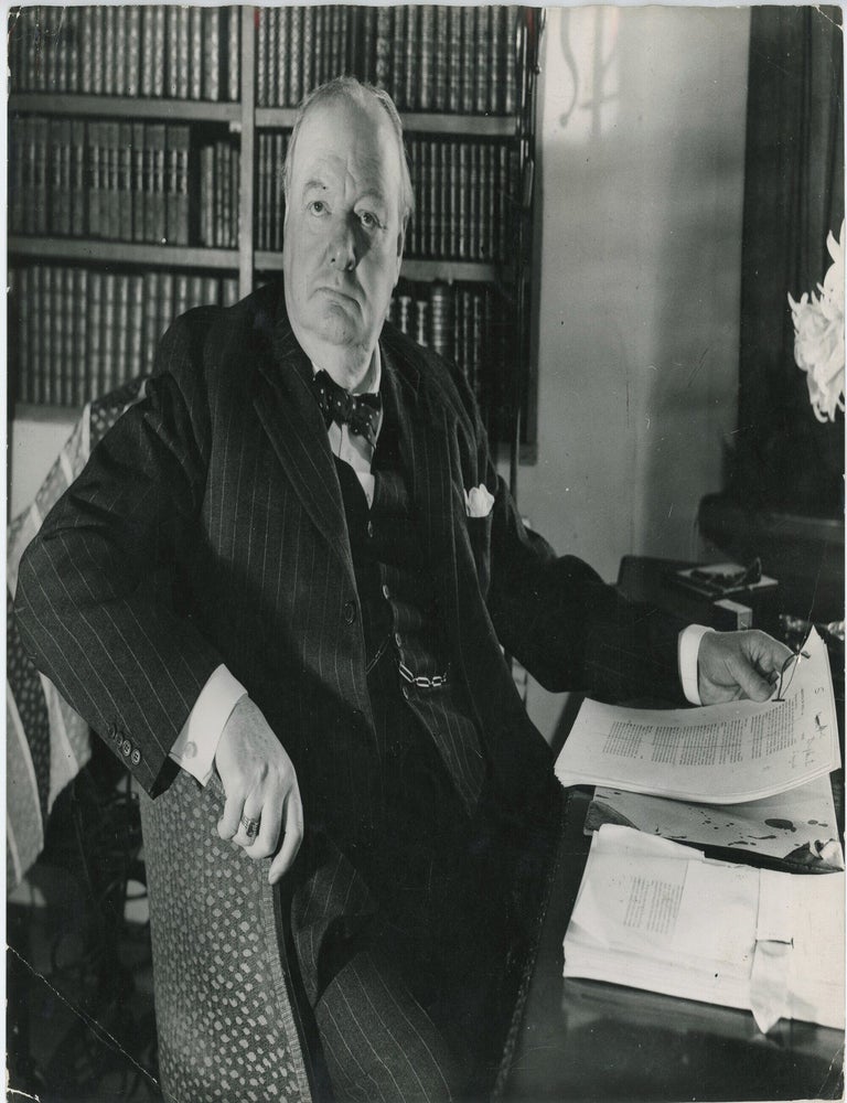 An original press photograph capturing Winston S. Churchill in late April 1948 reviewing galleys...