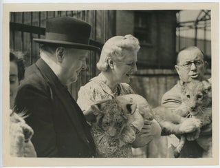Item #005232 An original wartime press photograph of Prime Minister Winston S. Churchill and...