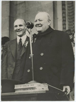 Item #005250 An original wartime press photograph of Prime Minister Winston S. Churchill giving a...