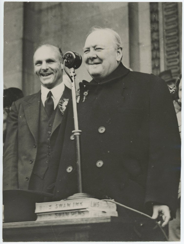 Item #005250 An original wartime press photograph of Prime Minister Winston S. Churchill giving a campaign speech using an improvised microphone stand during an election tour on 2 July 1945, 24 days before his Conservatives lost the General Election to Labour and Churchill relinquished his wartime premiership
