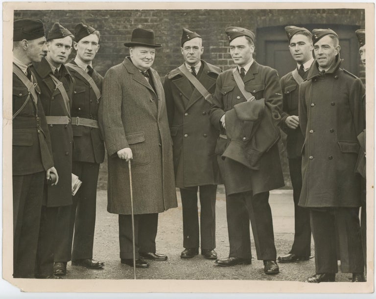 Item #005283 THERE'S PLENTY OF WORK FOR YOU BOYS - An original 17 April 1940 Second World War press photograph of then-First Lord of the Admiralty Winston S. Churchill posing with members of the Australian Air Force just three weeks before Churchill became wartime Prime Minister