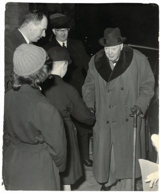 Item #005348 An original press photo of Sir Winston S. Churchill meeting the children of his...