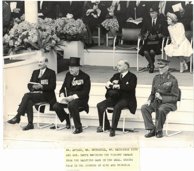 Item #005351 VICTORY DAY - An original press photograph capturing leaders of the Empire - Prime Minister Clement Attlee, former Prime Minister Winston S. Churchill, Canadian Prime Minister Mackenzie King, and South African Prime Minister Jan Smuts - at the post-Second World War London Victory Day Celebrations on 8 June 1946