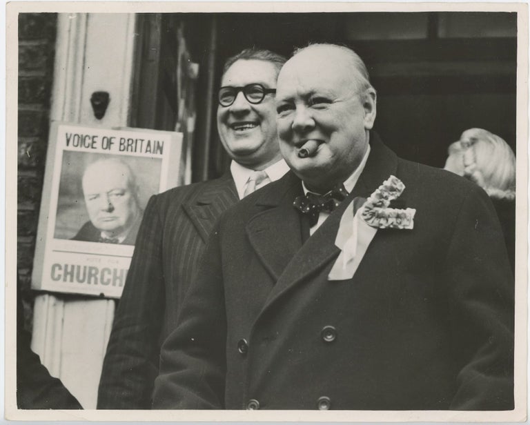 Item #005375 Churchill in two Moods - an original press photograph of Winston S. Churchill on an election tour of his Woodford constituency on 23 February 1950, the day of the 1950 General Election