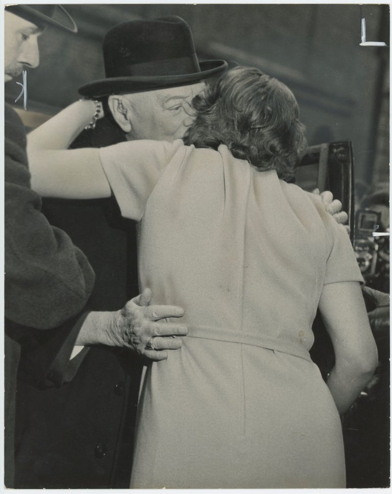 Item #005397 An original press photo of Sir Winston S. Churchill greeting and hugging his daughter, Mary, on 1 April 1963 - her mother, Lady Clementine Churchill's, 78th birthday