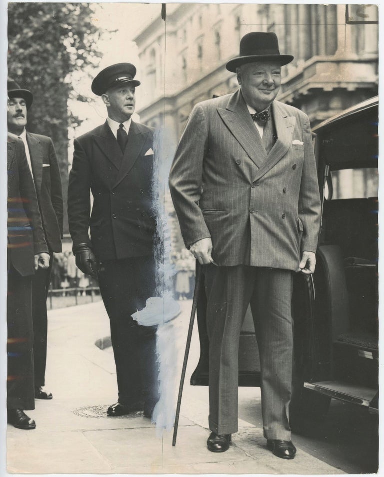 Item #005448 An original press photo of Sir Winston S. Churchill arriving at 10 Downing Street on 29 July 1955 to lunch with his successor, Prime Minister Anthony Eden, just a few months after Churchill's resignation and only days after Eden's summit with the U.S., Soviet, and French leaders