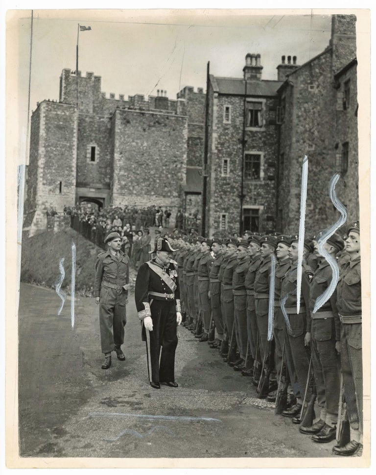 Item #005463 DOVER BELLS GREET MR. CHURCHILL AS NEW LORD WARDEN - An original press photograph of Winston S. Churchill (minus an epaulette) inspecting the guard of honour at Dover Castle following the ceremony for his installation as Lord Warden of the Cinque Ports on 14 August 1946