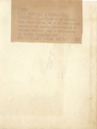 An original press photo of the 20 January 1941 Inaugural Parade for Franklin Delano Roosevelt’s unprecedented and unrepeated third presidential term, youth of his National Youth Administration passing in review as the President waves his hat