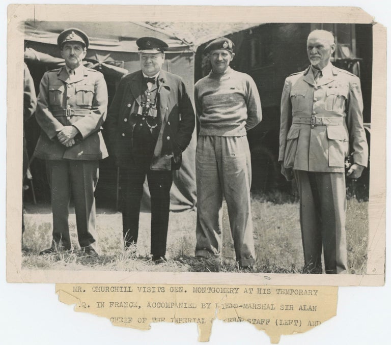 Item #005579 An original wartime press photograph of Prime Minister Winston S. Churchill, Field Marshal Sir Alan Brooke, and General Smuts with General Bernard Montgomery at his Headquarters in Normandy on 12 June 1944, less than a week after the D-Day landings
