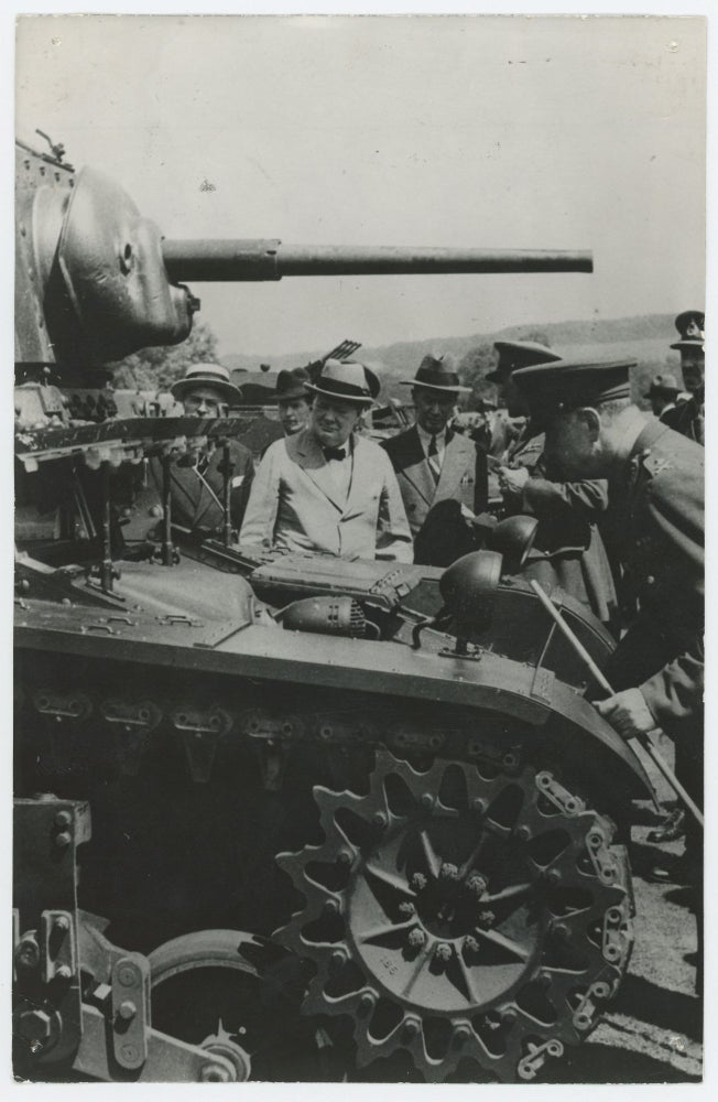 Item #005614 An original wartime Press photo of British Prime Minister Winston S. Churchill inspecting an American tank in August 1941