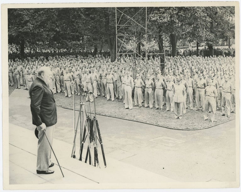 Item #005654 An original wartime press photograph of Prime Minister Winston S. Churchill addressing U.S. Naval and Army cadets at Harvard University on 6 September 1943 after receiving an honorary degree and delivering a speech