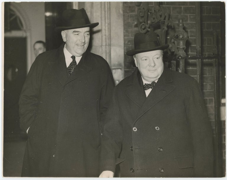 Item #005655 An original wartime press photograph of British Prime Minister Winston S. Churchill and Australian Prime Minister Robert Menzies at 10 Downing Street in February 1941, reportedly the first image captured of the two men together