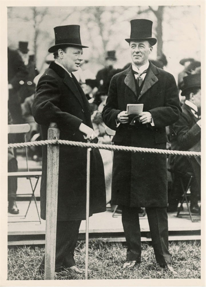 Item #006137 An original press photograph of then-First Lord of the Admiralty Winston Churchill and his friend and fellow Cabinet member, then-Secretary of State for War Jack Seely, watching the Review of the Brigade Guard in Hyde Park in 1913, on the verge of the First World War which would see them become the only two Cabinet members to also serve on the Front