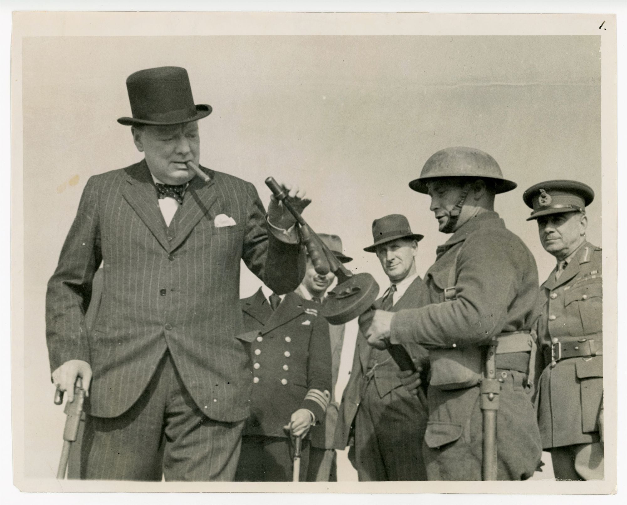 Mr. WINSTON CHURCHILL VISITS THE NORTH EAST - A Second World War British  Official War Office photograph of Prime Minister Winston S. Churchill on 13  August 1940 examining a Thompson submachine gun