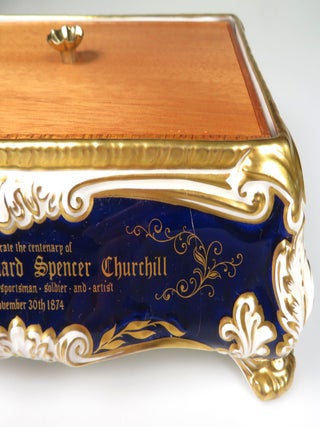 Elaborately detailed bone china cigar casket produced in 1974 for the centenary of Winston S. Churchill's birth, complete with cedar lining and original presentation case, copy #316 of the limited edition, accompanied by the original limitation certificate