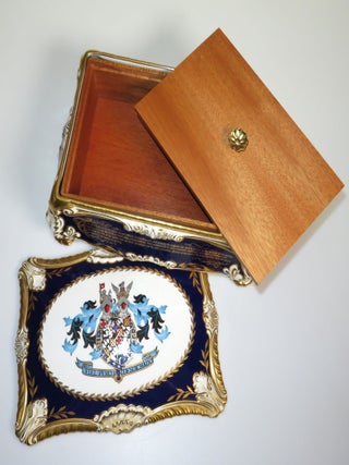 Elaborately detailed bone china cigar casket produced in 1974 for the centenary of Winston S. Churchill's birth, complete with cedar lining and original presentation case, copy #316 of the limited edition, accompanied by the original limitation certificate