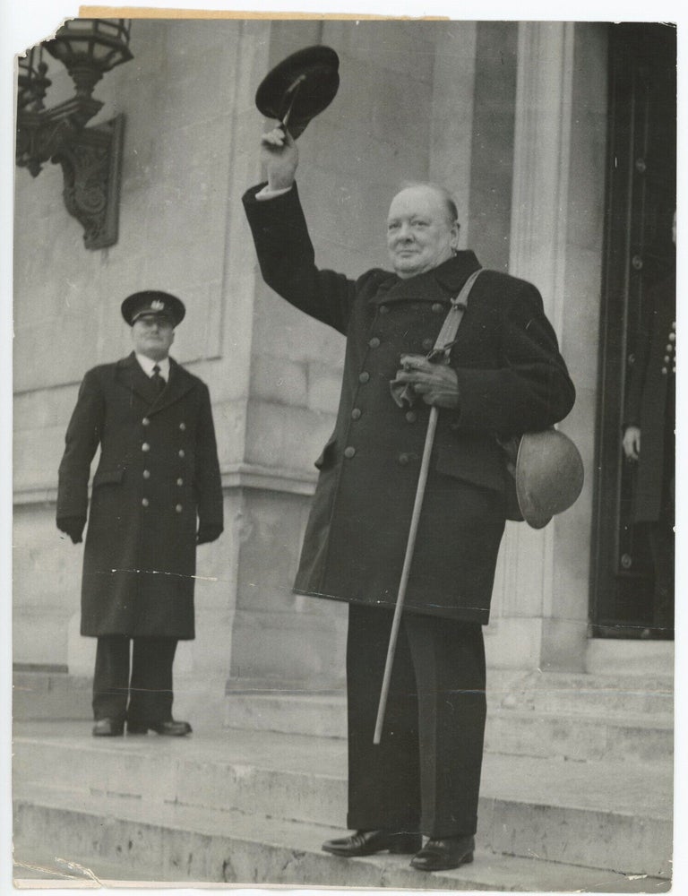 THE PRIME MINISTER SETS A GOOD EXAMPLE - An original Second World War press photograph of Prime...