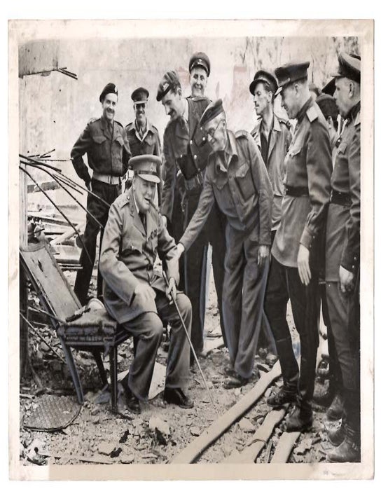 CHURCHILL ON EX-HOT SEAT - An original press photograph of Prime Minister Winston S. Churchill in...